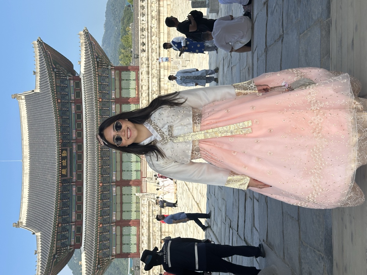 Me in a pink hanbok at Gyeongbokgung Palace